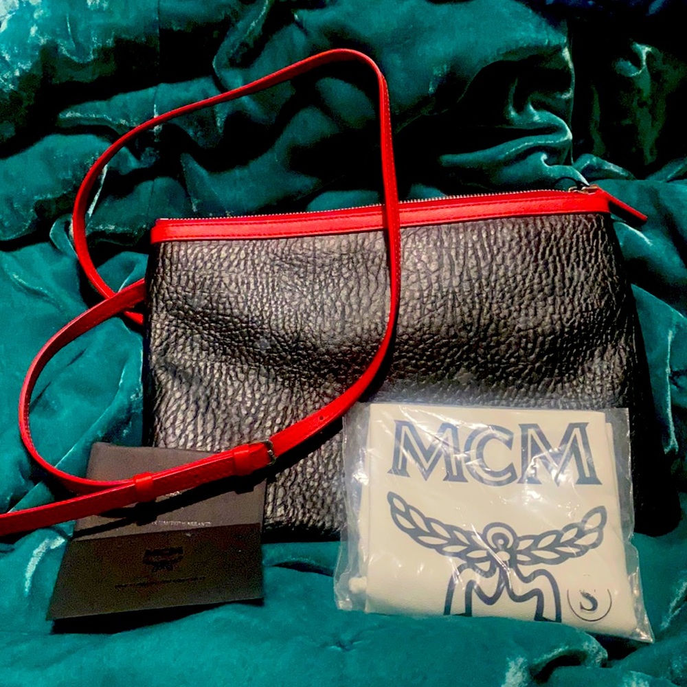 Brand new McM pouch long strap cross body style never worn tag still attached